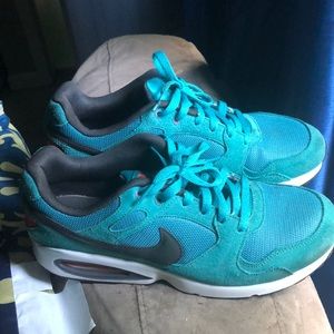 A pair of turquoise Air Max 95 size 10